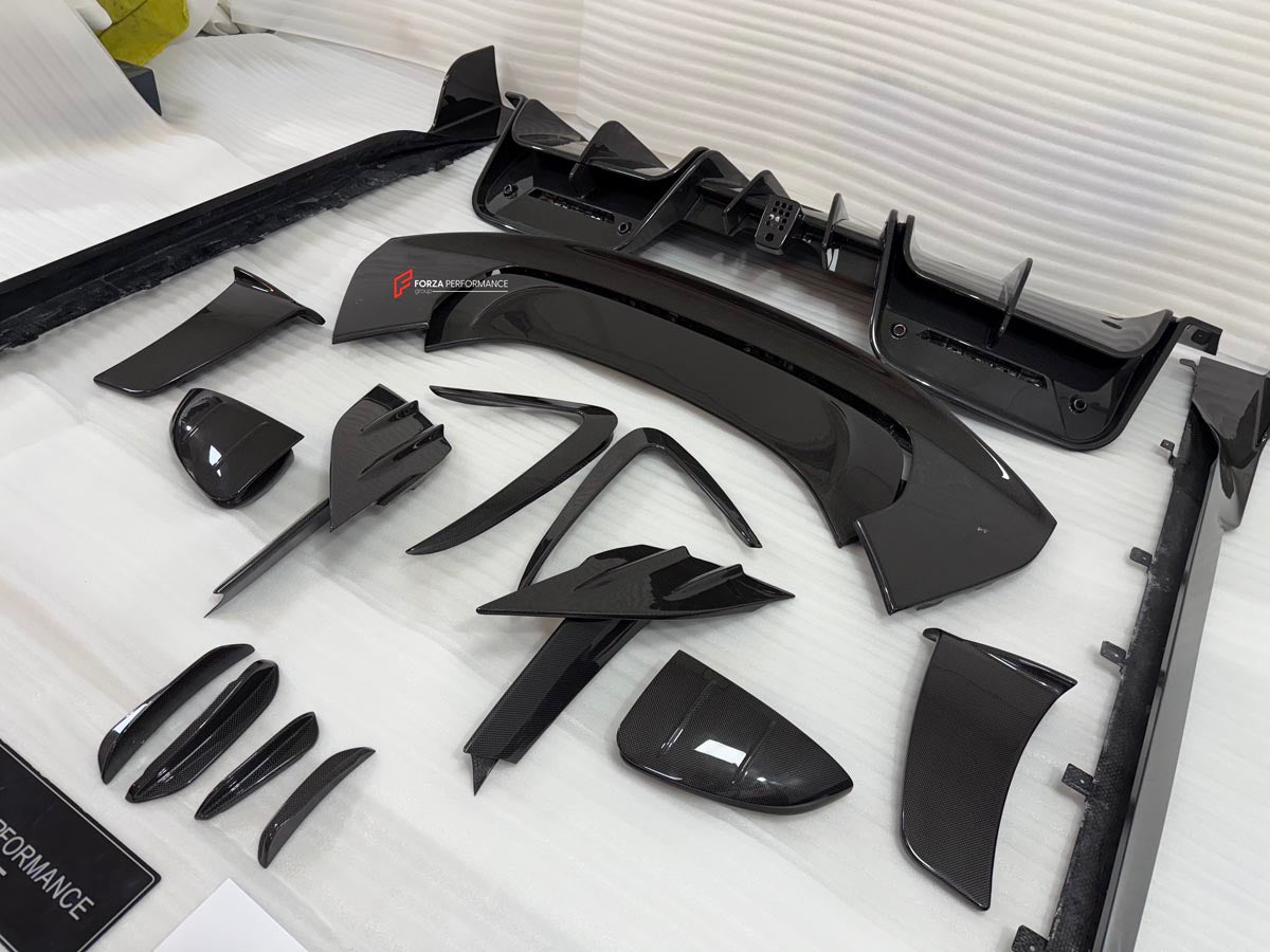 DRY CARBON BODY KIT for FERRARI SF90 2019+
Set includes:

Front Lip
Front Bumper Canards
Hood Bonnet Trim
Side Mirror Covers
Side Skirts
Rear Side Air Vents
Engine Bay Cover Lid
Rear Spoiler
Rear Diffuser
Material: Dry Carbon

NOTE: Professional installation is required.