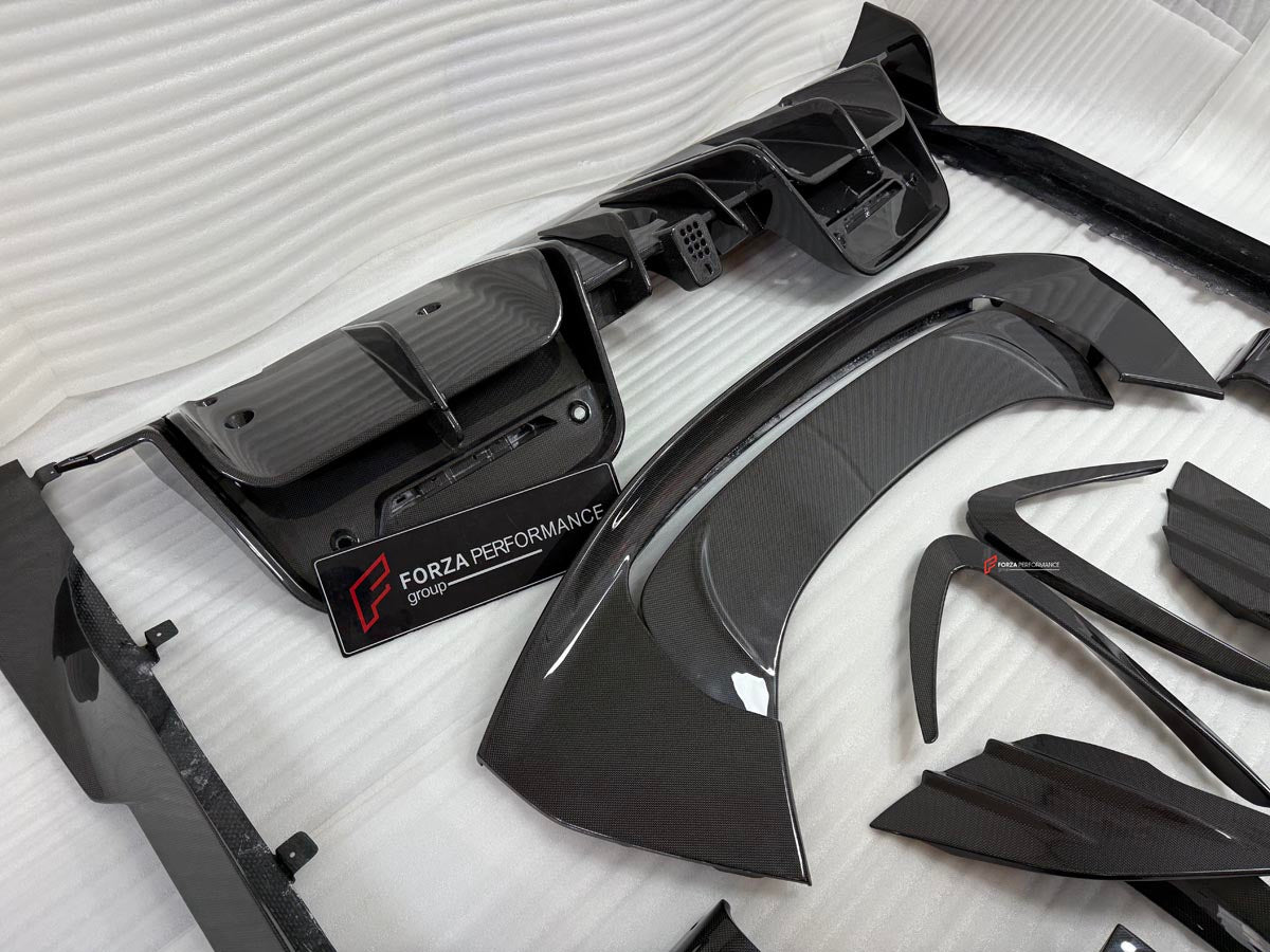 DRY CARBON BODY KIT for FERRARI SF90 2019+
Set includes:

Front Lip
Front Bumper Canards
Hood Bonnet Trim
Side Mirror Covers
Side Skirts
Rear Side Air Vents
Engine Bay Cover Lid
Rear Spoiler
Rear Diffuser
Material: Dry Carbon

NOTE: Professional installation is required.