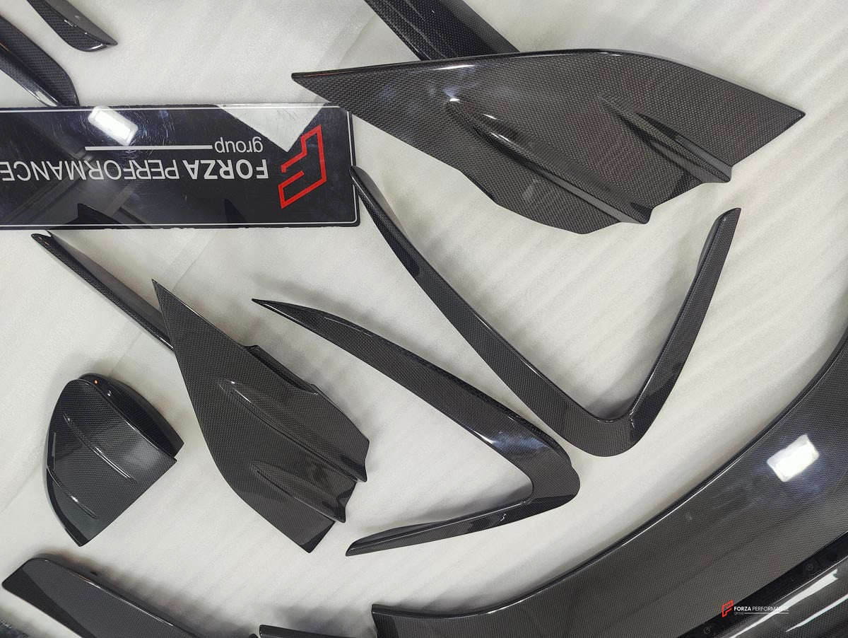 DRY CARBON BODY KIT for FERRARI SF90 2019+
Set includes:

Front Lip
Front Bumper Canards
Hood Bonnet Trim
Side Mirror Covers
Side Skirts
Rear Side Air Vents
Engine Bay Cover Lid
Rear Spoiler
Rear Diffuser
Material: Dry Carbon

NOTE: Professional installation is required.