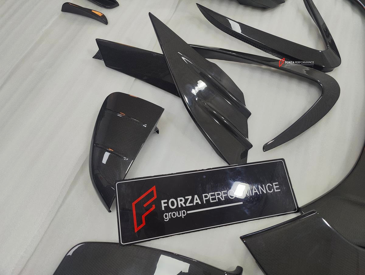 DRY CARBON BODY KIT for FERRARI SF90 2019+
Set includes:

Front Lip
Front Bumper Canards
Hood Bonnet Trim
Side Mirror Covers
Side Skirts
Rear Side Air Vents
Engine Bay Cover Lid
Rear Spoiler
Rear Diffuser
Material: Dry Carbon

NOTE: Professional installation is required.