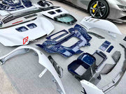 DRY CARBON BODY KIT for FERRARI SF90 2019+

Set includes:

Front Bumper Assembly
Front Bumper Canards
Front Splitter Endplates
Hood Bonnet
Front Trunk Trim
Front Fenders
Side Skirts
Quarter Panels
Side Air Vents
Engine Bay Cover Lid
Rear Wing Spoiler
Rear Bumper Assembly
Rear Diffuser

Material: Dry Carbon

Note: Professional installation is required.
