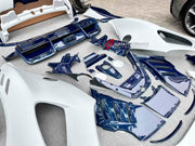 DRY CARBON BODY KIT for FERRARI SF90 2019+

Set includes:

Front Bumper Assembly
Front Bumper Canards
Front Splitter Endplates
Hood Bonnet
Front Trunk Trim
Front Fenders
Side Skirts
Quarter Panels
Side Air Vents
Engine Bay Cover Lid
Rear Wing Spoiler
Rear Bumper Assembly
Rear Diffuser

Material: Dry Carbon

Note: Professional installation is required.