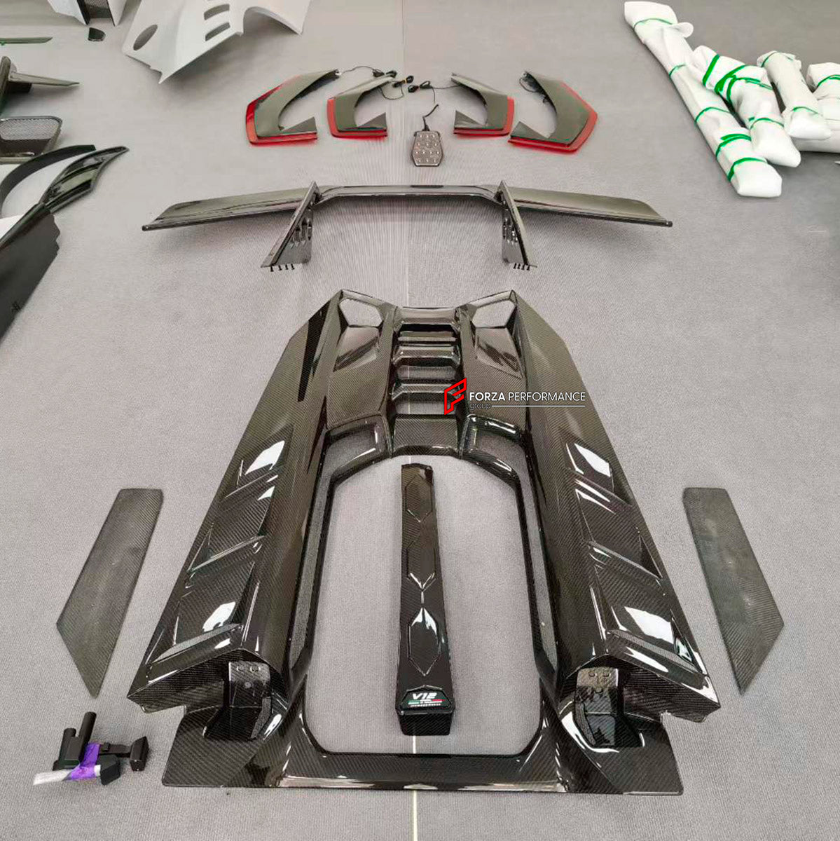 DRY CARBON BODY KIT for LAMBORGHINI REVUELTO 2023+ FORZA PERFORMANCE custom fit Duke Dynamics
Set includes:

Front Lip
Hood Bonnet
Side Skirts
Engine Cover
Rear Spoiler Wing
Rear Diffuser
Material: Dry Carbon

NOTE: Professional installation is required.