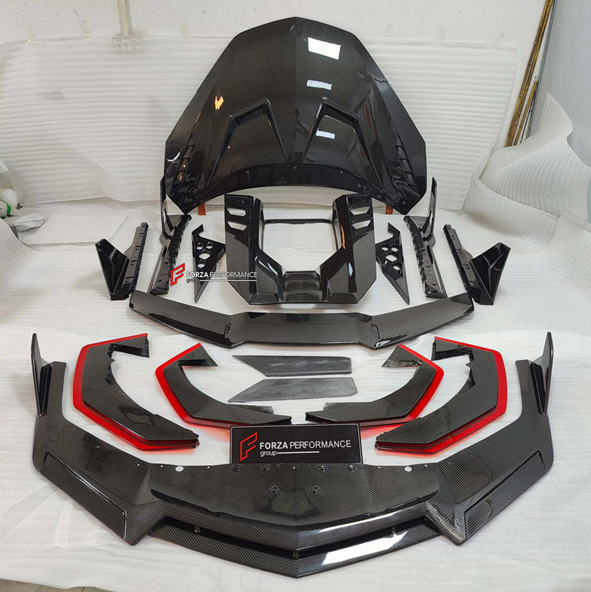DRY CARBON BODY KIT for LAMBORGHINI REVUELTO 2023+ FORZA PERFORMANCE custom fit Duke Dynamics
Set includes:

Front Lip
Hood Bonnet
Side Skirts
Engine Cover
Rear Spoiler Wing
Rear Diffuser
Material: Dry Carbon

NOTE: Professional installation is required.