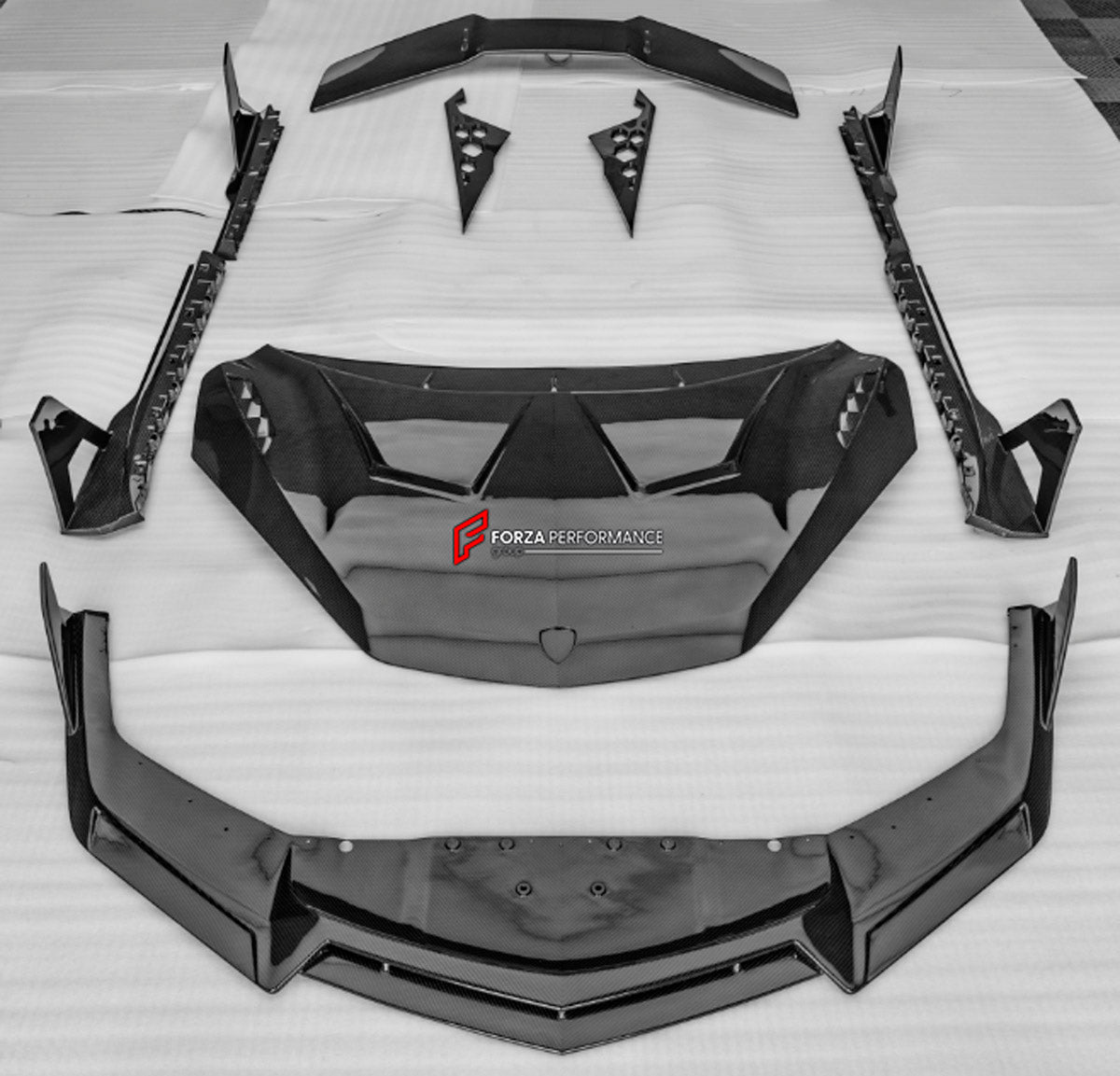 DRY CARBON BODY KIT for LAMBORGHINI REVUELTO 2023+ FORZA PERFORMANCE custom fit Duke Dynamics
Set includes:

Front Lip
Hood Bonnet
Side Skirts
Engine Cover
Rear Spoiler Wing
Rear Diffuser
Material: Dry Carbon

NOTE: Professional installation is required.