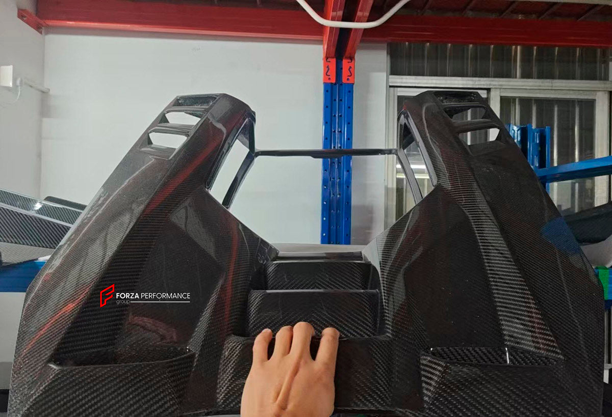 DRY CARBON BODY KIT for LAMBORGHINI REVUELTO 2023+ FORZA PERFORMANCE custom fit Duke Dynamics
Set includes:

Front Lip
Hood Bonnet
Side Skirts
Engine Cover
Rear Spoiler Wing
Rear Diffuser
Material: Dry Carbon

NOTE: Professional installation is required.