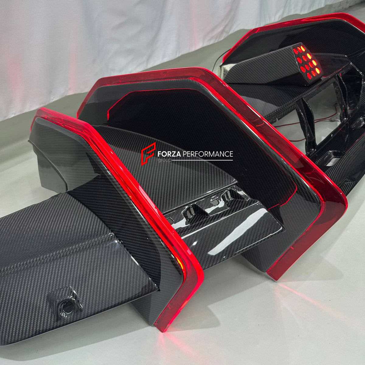 DRY CARBON BODY KIT for LAMBORGHINI REVUELTO 2023+ FORZA PERFORMANCE custom fit DK Style

Set includes:
Front Lip
Side Skirts
Rear Spoiler Wing
Engine Cover
Rear Diffuser

Material: Dry Carbon

NOTE: Professional installation is required.