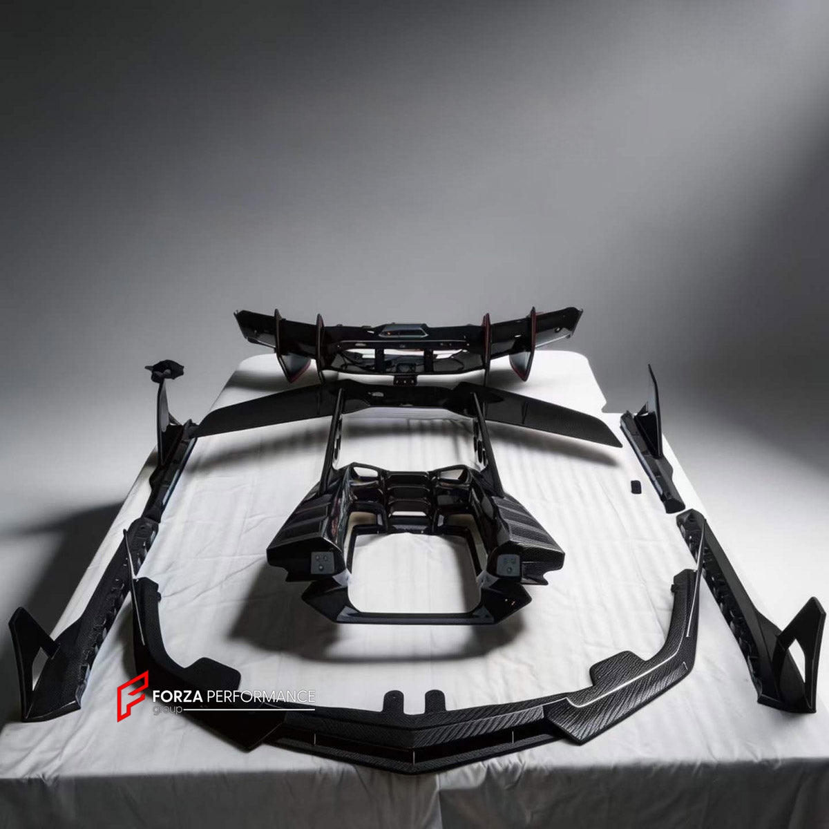 DRY CARBON BODY KIT for LAMBORGHINI REVUELTO 2023+ FORZA PERFORMANCE custom fit Duke Style

Set includes:
Front Lip
Hood Bonnet
Side Skirts
Rear Spoiler Wing
Engine Cover
Rear Diffuser

Material: Dry Carbon

NOTE: Professional installation is required.