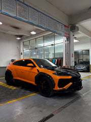 DRY CARBON BODY KIT for LAMBORGHINI URUS SE 2024+
Set includes:

Front Lip
Hood Bonnet
Fender Flares
Side Skirts
Roof Spoiler
Ducktail Spoiler
Rear Diffuser
Material: Dry Carbon

NOTE: Professional installation is required.