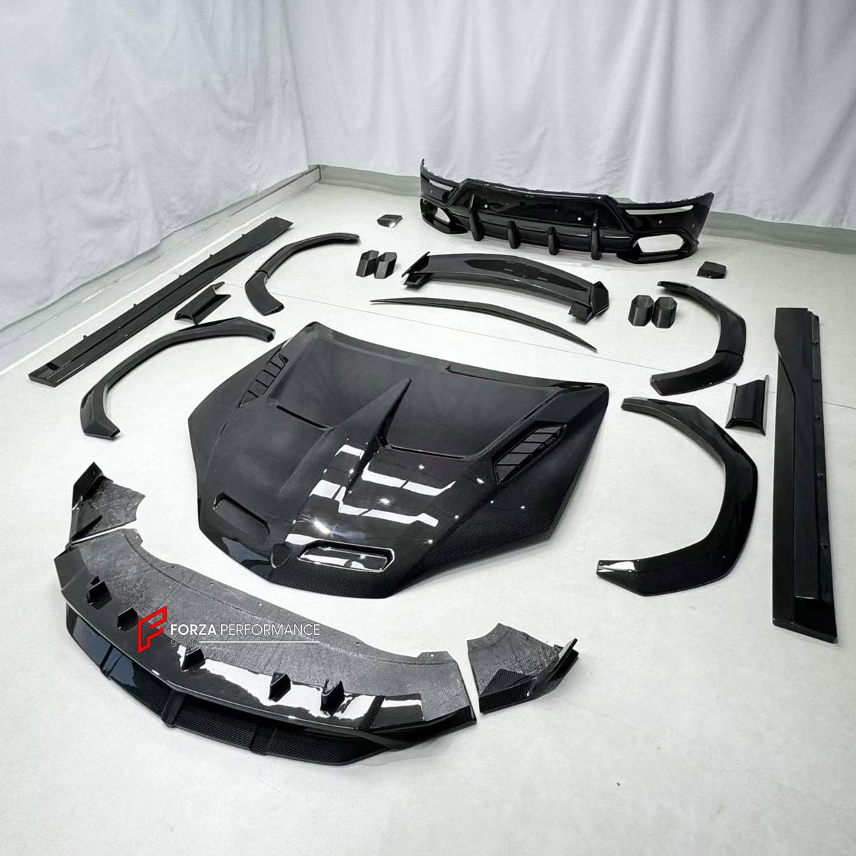 DRY CARBON BODY KIT for LAMBORGHINI URUS SE 2024+ FORZA PERFORMANCE custom fit U Style

Set includes:
Front Lip
Hood Bonnet
Fender Flares
Side Skirts
Roof Spoiler
Ducktail Spoiler
Rear Diffuser

Material: Dry Carbon

NOTE: Professional installation is required.