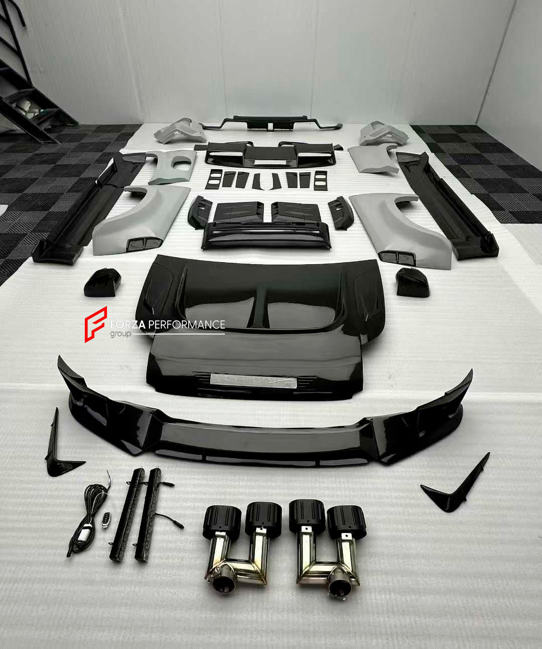 DRY CARBON BODY KIT for LAND ROVER DEFENDER L663 110 2020+

Set includes:

Front Lip
Front Bumper
Front Canards
Front Grille
Headlight Covers
Hood
Roof LED DRL Bar
Fender Flares
Side Mirror Covers
Door Panels
Side Skirts
Roof Spoiler
Tail Lights Covers
Rear Bumper
Rear Diffuser
Exhaust Tips
Spare Tire Cover
Material: Dry Carbon

Note: Professional installation is required.