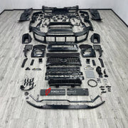 DRY CARBON BODY KIT for MERCEDES-BENZ G-CLASS W464 W465 2018+

Set includes:
Front Lip
Front Bumper Assembly
Front Grille
Fender Flares
Side Skirts
Rear Bumper Assembly
Rear Diffuser

Material: Dry Carbon, Plastic

NOTE: Professional installation is required.