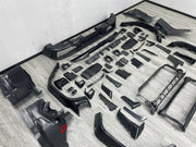 DRY CARBON BODY KIT for MERCEDES-BENZ G-CLASS W464 W465 2018+

Set includes:
Front Lip
Front Bumper Assembly
Front Grille
Fender Flares
Side Skirts
Rear Bumper Assembly
Rear Diffuser

Material: Dry Carbon, Plastic

NOTE: Professional installation is required.