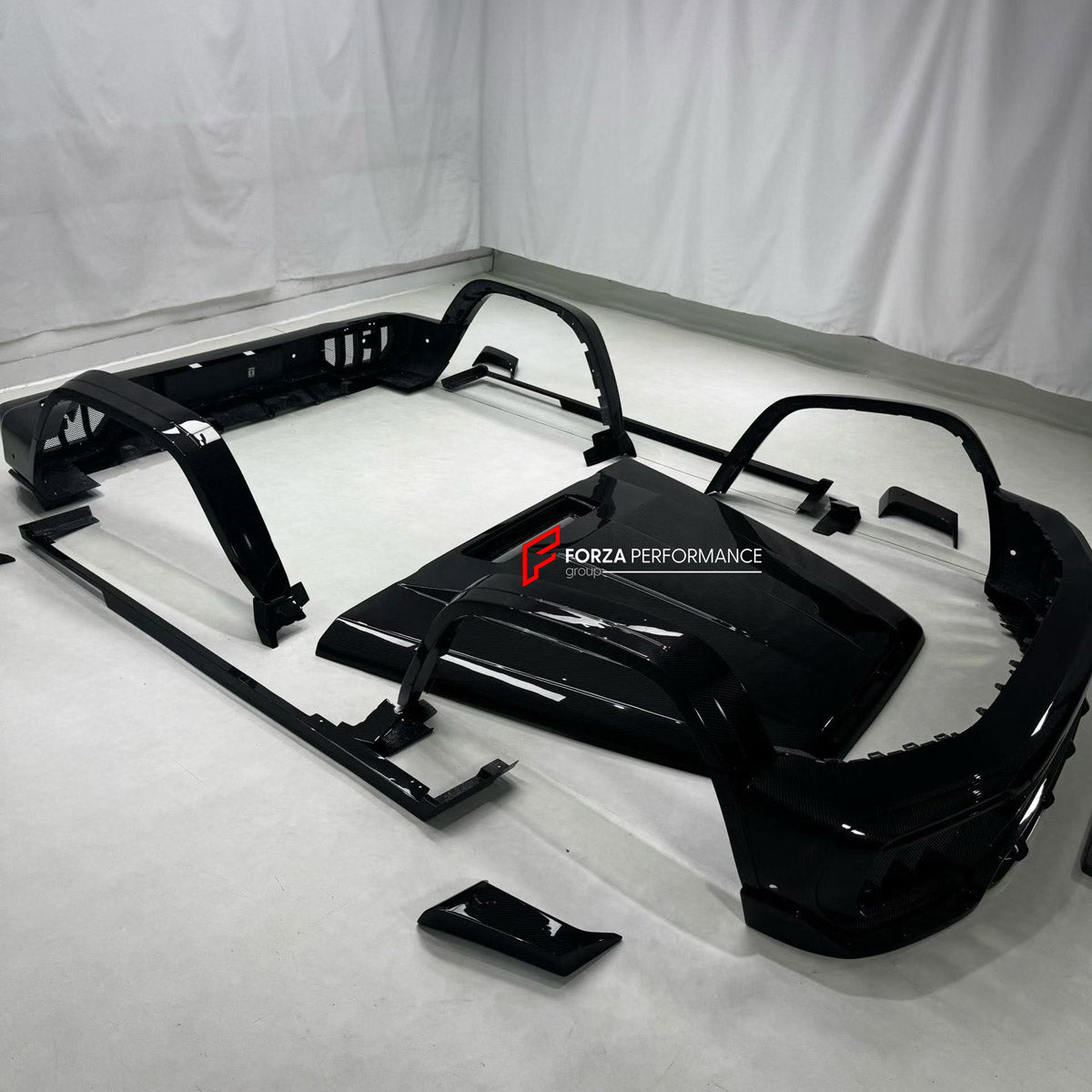 DRY CARBON BODY KIT for MERCEDES-BENZ G CLASS W464 W465 G63 G350 G500 2018+ FORZA PERFORMANCE custom fit Topcar Style

Set includes:
Front Bumper
Hood Bonnet
Front Fenders
Fender Flares
Side Steps
Rear Fenders
Rear Bumper
Rear Diffuser

Material: Dry Carbon

NOTE: Professional installation is required.