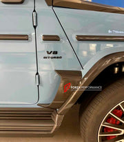 DRY CARBON BODY KIT for MERCEDES BENZ G-CLASS W465 G63 G550 G500 G350 2024+

Set includes:

Front Lip
Front Bumper Side Air Vents
Front Bumper Cover
Front Grille Frame
Headlights Cover
Hood / Bonnet
Turning Lights Frame
Side Mirror Covers
Side Moldings Trims
Fender Flares
Side Skirts
Exhaust Tips
Roof Cover with LED Lights
Rear Spoiler
D-Pillar Add-Ons
Spare Tire Cover
Rear Bumper Covers
Rear Diffuser

Material: Dry Carbon