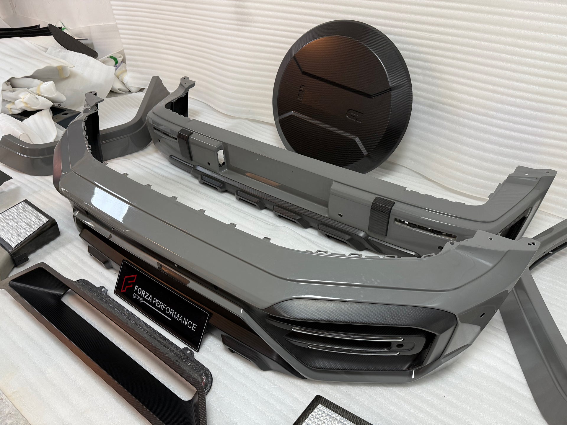 DRY CARBON BODY KIT for MERCEDES BENZ G-CLASS W465 G63 G550 G500 G350 2024+

Set includes:

Front Bumper Assembly
Front Bumper Air Vents Cover
DRL LED Lights
Front Fender Trim
Fender Flares
Side Skirts
Exhaust System
Exhaust Tips
Spare Tire Cover
Rear Bumper

Rear Bumper Trims
Rear Diffuser

Material: Dry Carbon

NOTE:&nbsp;Professional installation is required.

Why “Contact Us for Pricing”?

We don’t display fixed prices because our goal is to offer you the most competitive deal possible. Product costs of