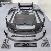DRY CARBON BODY KIT for ROLLS ROYCE GHOST RR21 FACELIFT 2025+ FORZA PERFORMANCE Mansory+
Set includes:

Front Lip
Front Bumper Assembly
Hood Bonnet
Side Skirts
Ducktail Spoiler
Rear Bumper Assembly
Rear Diffuser
Material: Dry Carbon

NOTE: Professional installation is required.