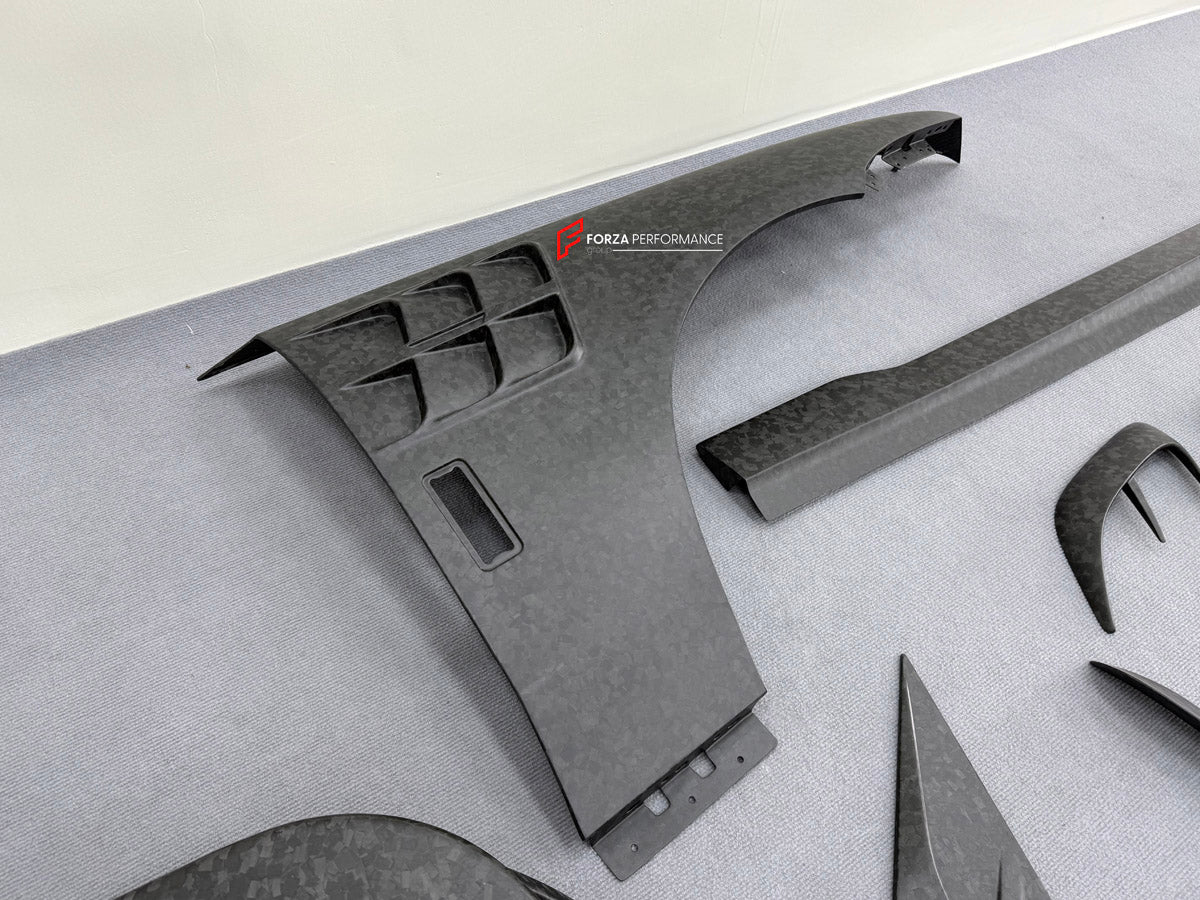DRY CARBON BODY KIT for ROLLS ROYCE GHOST RR21 FACELIFT 2025+ FORZA PERFORMANCE Mansory+
Set includes:

Front Lip
Front Bumper Assembly
Hood Bonnet
Side Skirts
Ducktail Spoiler
Rear Bumper Assembly
Rear Diffuser
Material: Dry Carbon

NOTE: Professional installation is required.