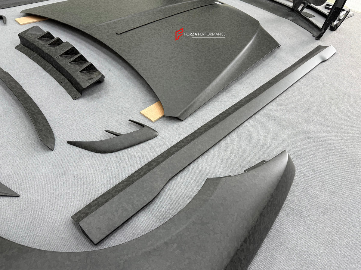 DRY CARBON BODY KIT for ROLLS ROYCE GHOST RR21 FACELIFT 2025+ FORZA PERFORMANCE Mansory+
Set includes:

Front Lip
Front Bumper Assembly
Hood Bonnet
Side Skirts
Ducktail Spoiler
Rear Bumper Assembly
Rear Diffuser
Material: Dry Carbon

NOTE: Professional installation is required.