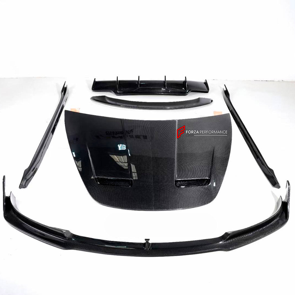 DRY CARBON BODY KIT for Tesla Model 3 V 2017 - 2023
Set includes:

Front Lip
Hood Bonnet
Side Skirts
Ducktail Spoiler
Rear Diffuser
Material: Carbon

NOTE: Professional installation is required.