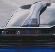 DRY CARBON FIBER F1 ROOF AIR INTAKE SPOILER for PORSCHE 911 992.1 TURBO 2019 - 2025

Set includes:

Roof Air Intake Spoiler
Material: Dry Carbon Fiber

NOTE: Professional installation is required.