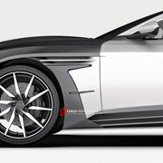 DRY CARBON FIBER FENDER TRIMS for ASTON MARTIN DB11 2016 - 2023
Set includes:

Fender Trims
Material: Dry Carbon

NOTE: Professional installation is required.