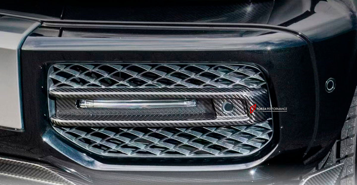 DRY CARBON Front Bumber Air Vents for Mercedes Benz W464 G63 2018 - 2024
Set includes:

Front Bumber Air Vents
Led Lights
Material: Dry Carbon

NOTE: Professional installation is required.