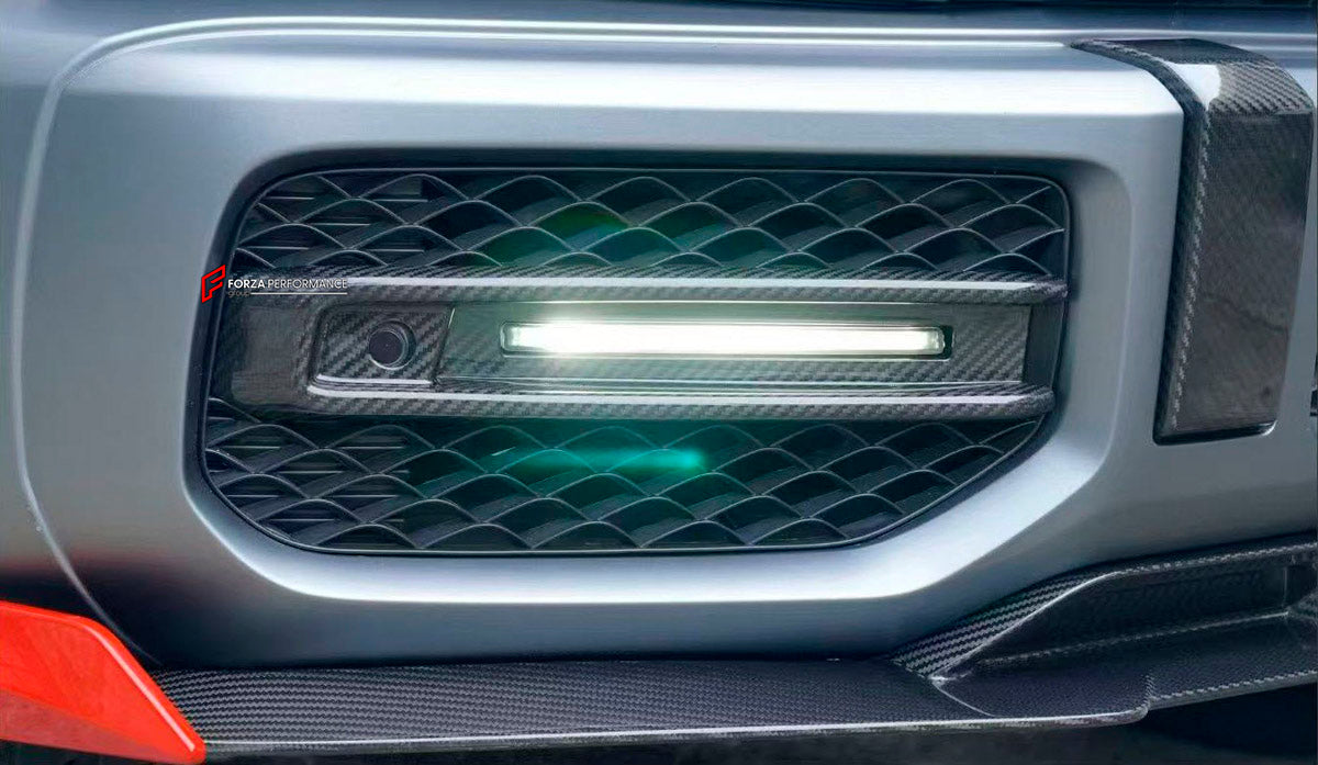 DRY CARBON Front Bumber Air Vents for Mercedes Benz W464 G63 2018 - 2024
Set includes:

Front Bumber Air Vents
Led Lights
Material: Dry Carbon

NOTE: Professional installation is required.
