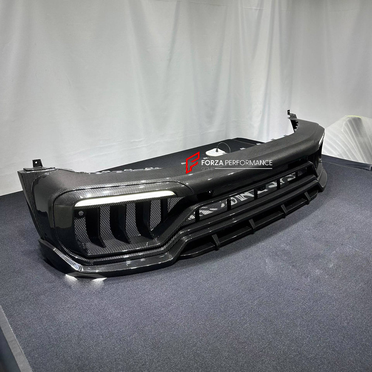 DRY CARBON FRONT BUMPER ASSEMBLY for MERCEDES-BENZ G-CLASS W464 W465 G350 G500 G63 2018+ FORZA PERFORMANCE custom fit TC Style

Set includes:
Front Bumper Assembly

Material: Dry Carbon

NOTE: Professional installation is required.