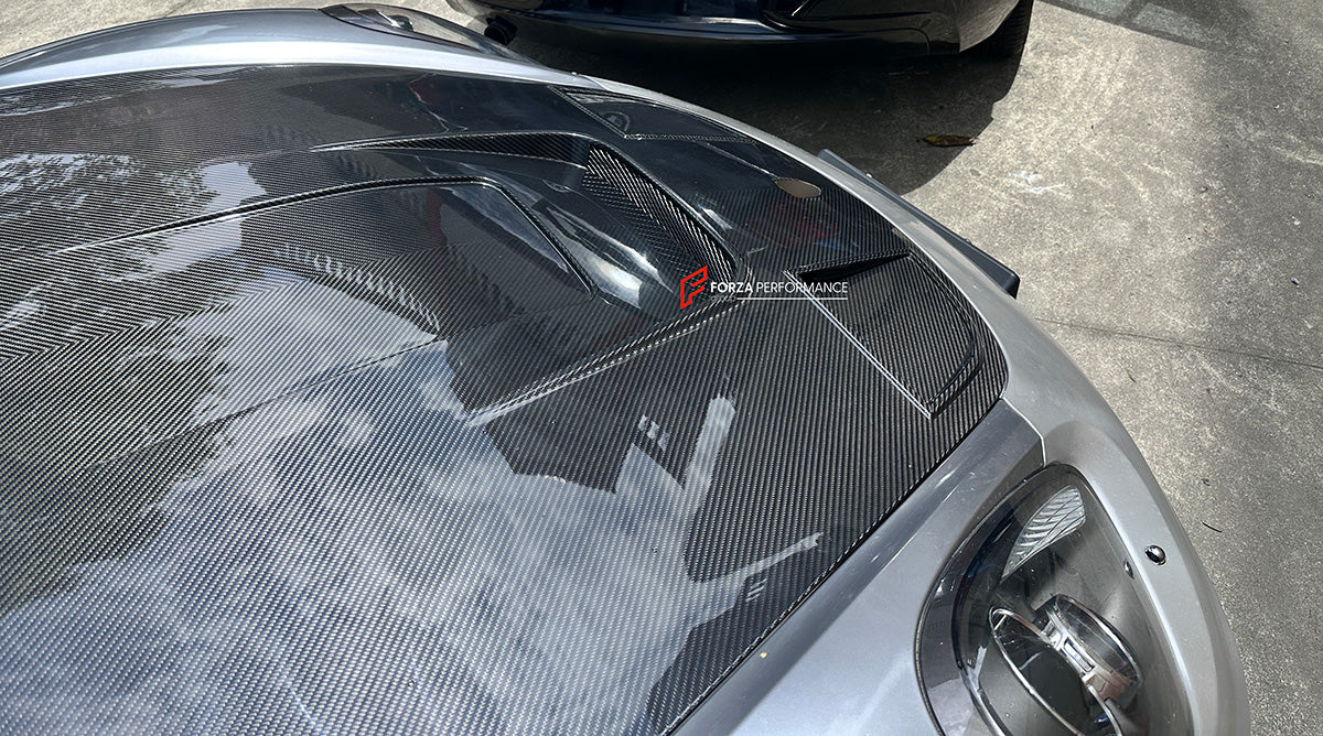 CARBON FIBER HOOD BONNET for PORSCHE 718 981 982 CAYMAN BOXSTER 2012+

Set includes:

Hood Bonnet

Fitment models:

Boxster III (981) 2012 - 2016
Cayman II (981) 2014 - 2016
718 I (982) 2017+

Material: Dry Carbon

Note: Professional installation is required
