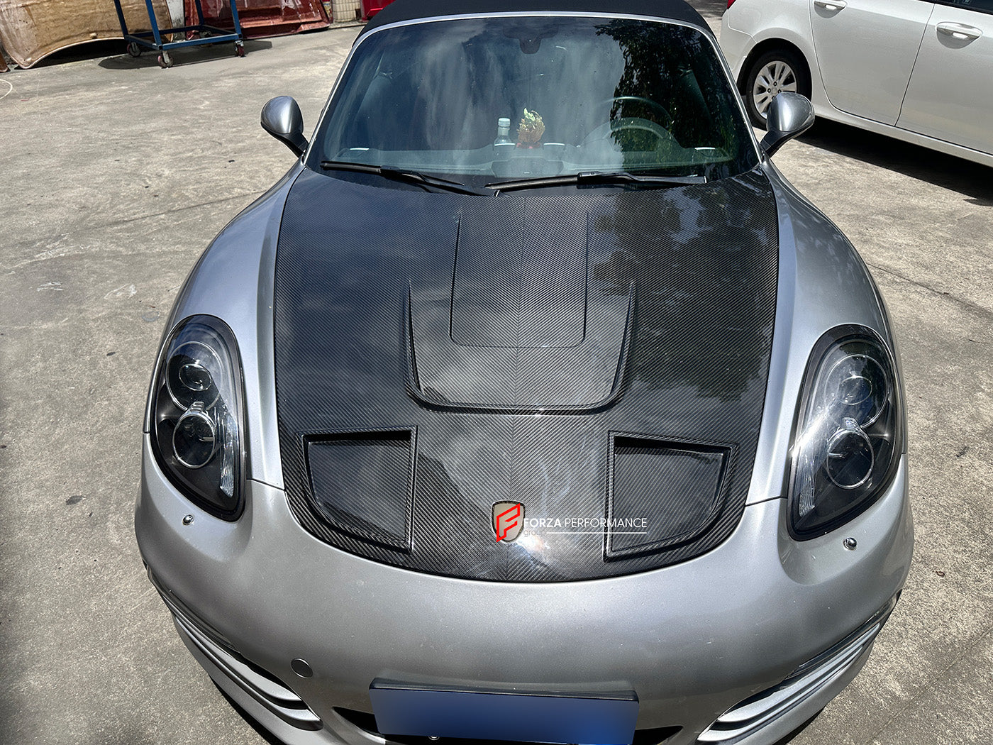 CARBON FIBER HOOD BONNET for PORSCHE 718 981 982 CAYMAN BOXSTER 2012+

Set includes:

Hood Bonnet

Fitment models:

Boxster III (981) 2012 - 2016
Cayman II (981) 2014 - 2016
718 I (982) 2017+

Material: Dry Carbon

Note: Professional installation is required
