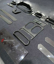 Dry Carbon Interior Kit for Lamborghini Urus 2018+
Set includes:

Dashboard Panel Cover
Meter Base Panel Cover
Central Control Panel Trim
Center Console Air Outlet Cover Trim
Material: Dry Carbon

NOTE: Professional installation is required.