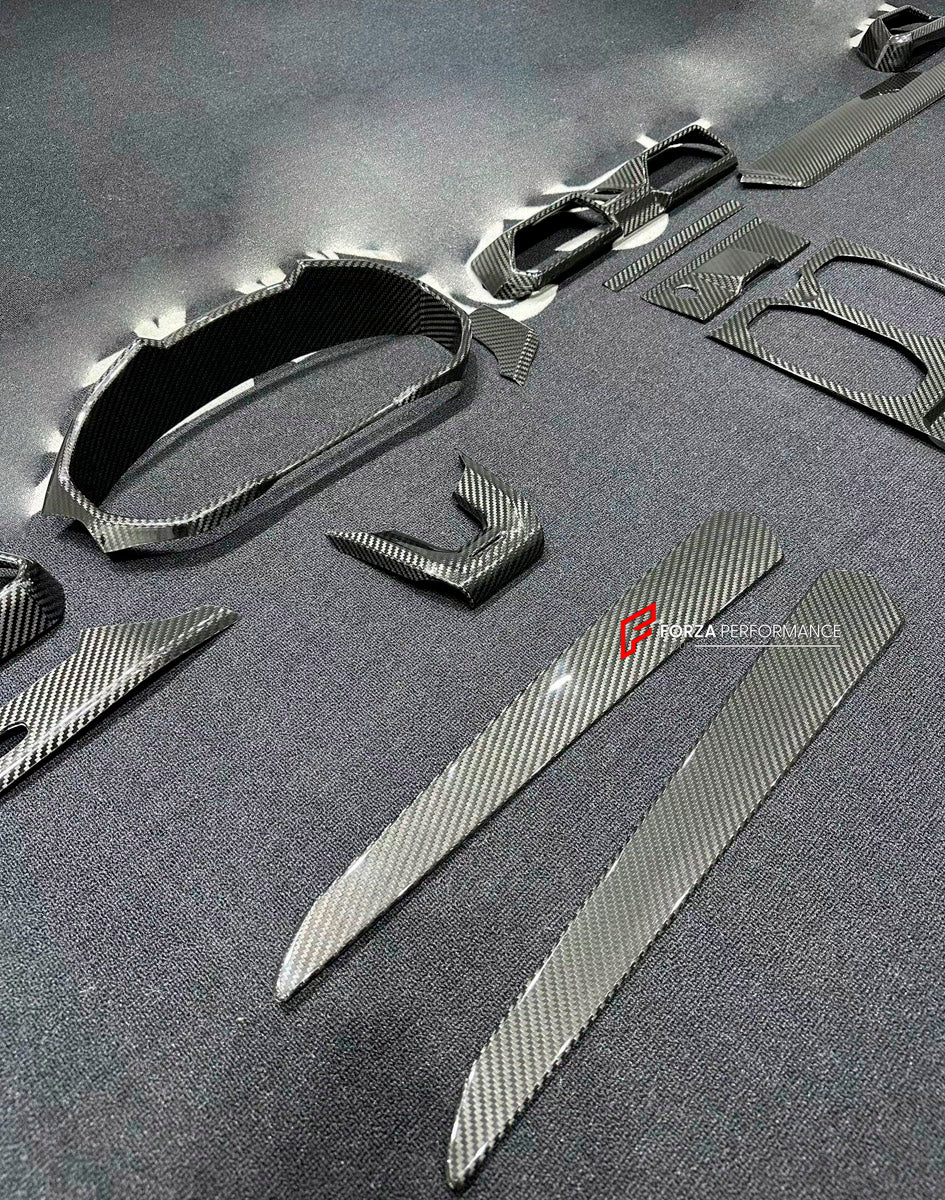 Dry Carbon Interior Kit for Lamborghini Urus 2018+
Set includes:

Dashboard Panel Cover
Meter Base Panel Cover
Central Control Panel Trim
Center Console Air Outlet Cover Trim
Material: Dry Carbon

NOTE: Professional installation is required.