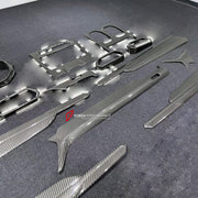 DRY CARBON INTERIOR KIT for LAMBORGHINI URUS 2018+

Set includes:
Dashboard Instrument Cluster Trim
Dashboard Panel Cover
Meter Base Panel Cover
Central Control Panel Trim
Center Console Air Outlet Cover Trim
Dashboard Trim Kit
Interior Door Panel Trim

Material: Dry Carbon

NOTE: Professional installation is required.
