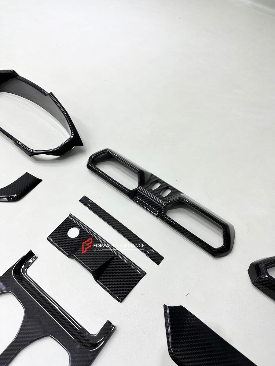 DRY CARBON INTERIOR KIT for Lamborghini Urus SE 2024+
Set includes:

Dashboard Instrument Cluster Trim
Center Console Trim Cover
Rear Center Console Air Vent Cover
Dashboard Trim Kit
Dashboard Side Air Vents Covers
Interior Door Panel Trim
Material: Dry Carbon

NOTE: Professional installation is required.
