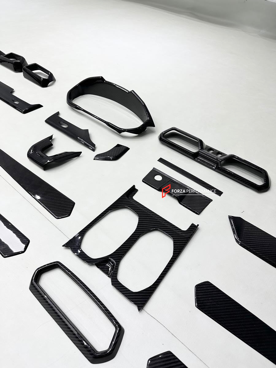 DRY CARBON INTERIOR KIT for Lamborghini Urus SE 2024+
Set includes:

Dashboard Instrument Cluster Trim
Center Console Trim Cover
Rear Center Console Air Vent Cover
Dashboard Trim Kit
Dashboard Side Air Vents Covers
Interior Door Panel Trim
Material: Dry Carbon

NOTE: Professional installation is required.