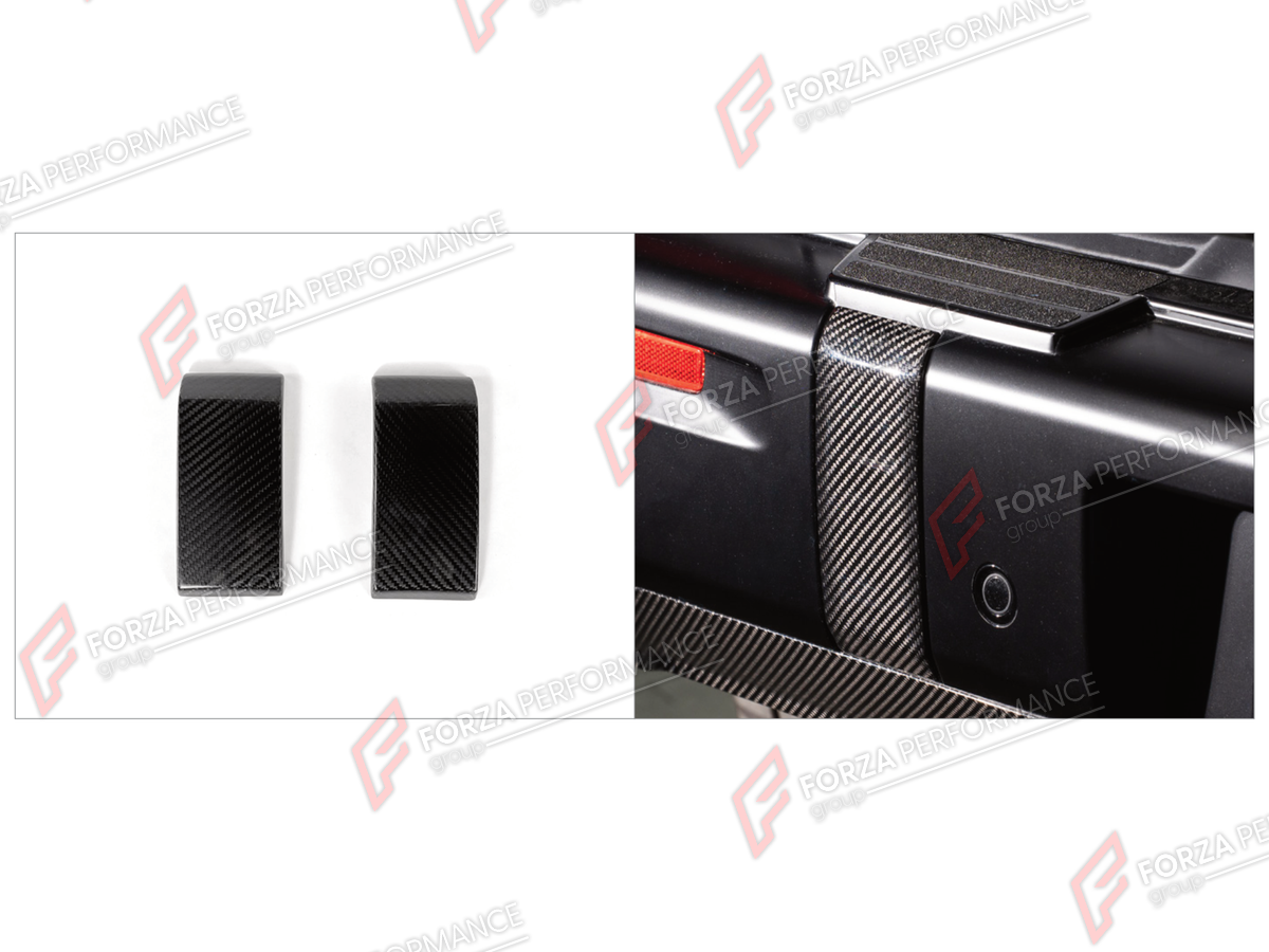DRY CARBON REAR BUMPER COVER TRIMS for MERCEDES-BENZ G-CLASS W465 G63 G450D G500 G550 2025+

Set includes:
Rear Bumper Cover Trims

Material: Dry Carbon

NOTE: Professional installation is required.