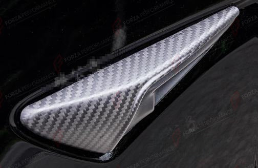 DRY CARBON SIDE CAMERA COVERS HALF COVERAGE for TESLA MODEL Y JUNIPER 2025+
Set includes:

Side Camera Covers (half coverage)
Material: Dry Carbon

NOTE: Add-on type - installs over the original part. Professional installation is required.