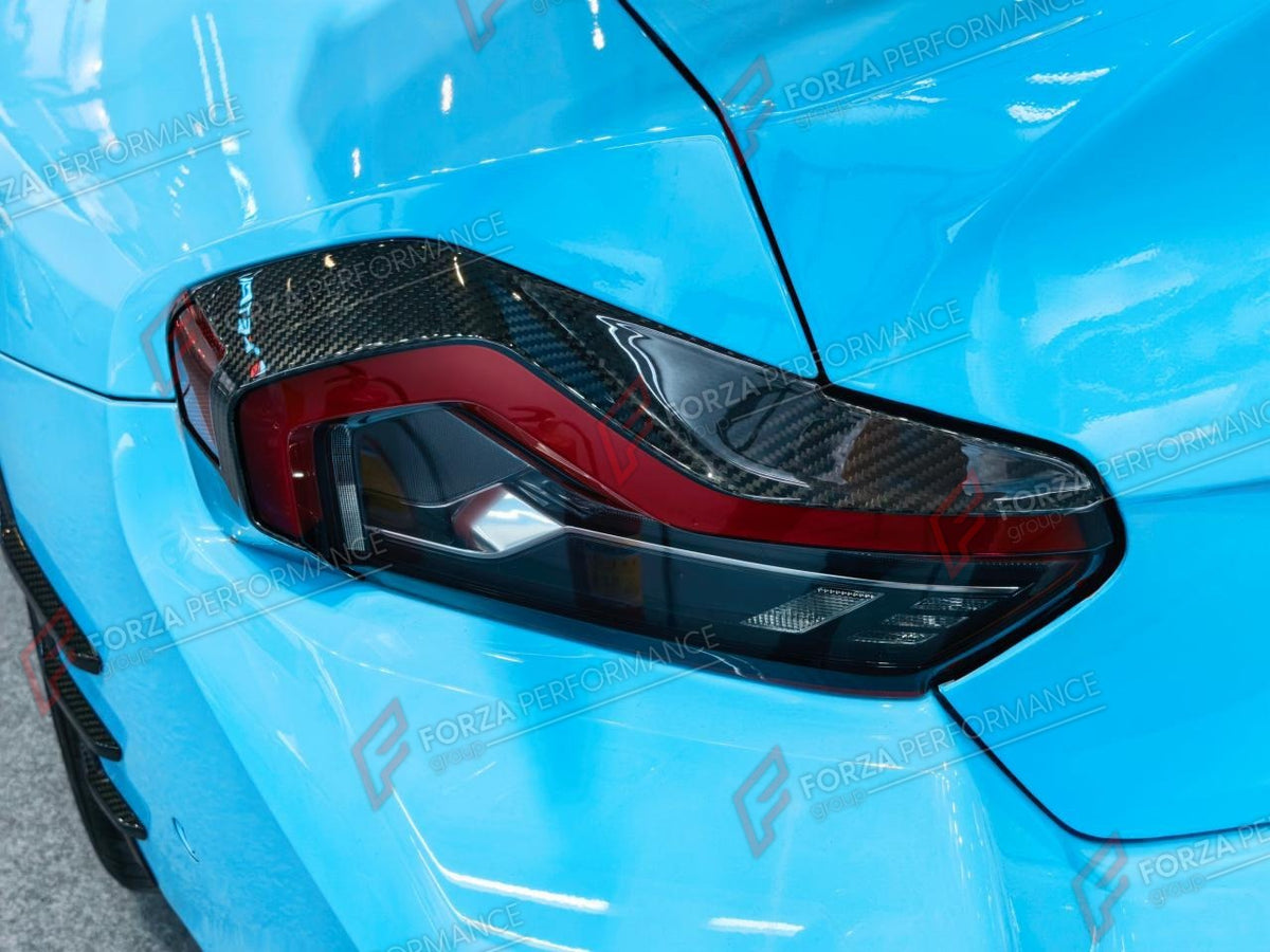 DRY CARBON TAIL LIGHT EYEBROWS for BMW M2 G87 2023+
Set includes:

Tail Light Eyebrows
Material: Dry Carbon

NOTE: Add-on type - installs over the original part. Professional installation is required.