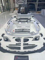 DRY CARBON WIDE BODY KIT for BENTLEY CONTINENTAL GT GTC 2018 - 2024

Set includes:
Front Lip
Front Bumper
Front Bumper Trims
Grille
Hood / Bonnet
Front Fenders
Side Mirror Covers
Side Trims
Side Skirts
Folding Roof Cover
Rear Spoiler
Rear Bumper
Rear Diffuser

Material: Dry Carbon

Note: Professional installation is required.