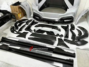 DRY CARBON WIDE BODY KIT for FERRARI PUROSANGUE 2023+ FORZA PERFORMANCE Mansory Keyvany
Set includes:

Front Lip
Front Bumper Assembly
Hood Bonnet
Front Fenders
Fender Flares
Side Skirts
Rear Fenders
Roof Spoiler
Ducktail Spoiler
Rear Diffuser
Rear Bumper Assembly
Material: Dry Carbon

NOTE: Professional installation is required.