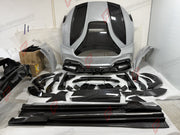 DRY CARBON WIDE BODY KIT for FERRARI PUROSANGUE 2023+ FORZA PERFORMANCE Mansory Keyvany
Set includes:

Front Lip
Front Bumper Assembly
Hood Bonnet
Front Fenders
Fender Flares
Side Skirts
Rear Fenders
Roof Spoiler
Ducktail Spoiler
Rear Diffuser
Rear Bumper Assembly
Material: Dry Carbon

NOTE: Professional installation is required.
