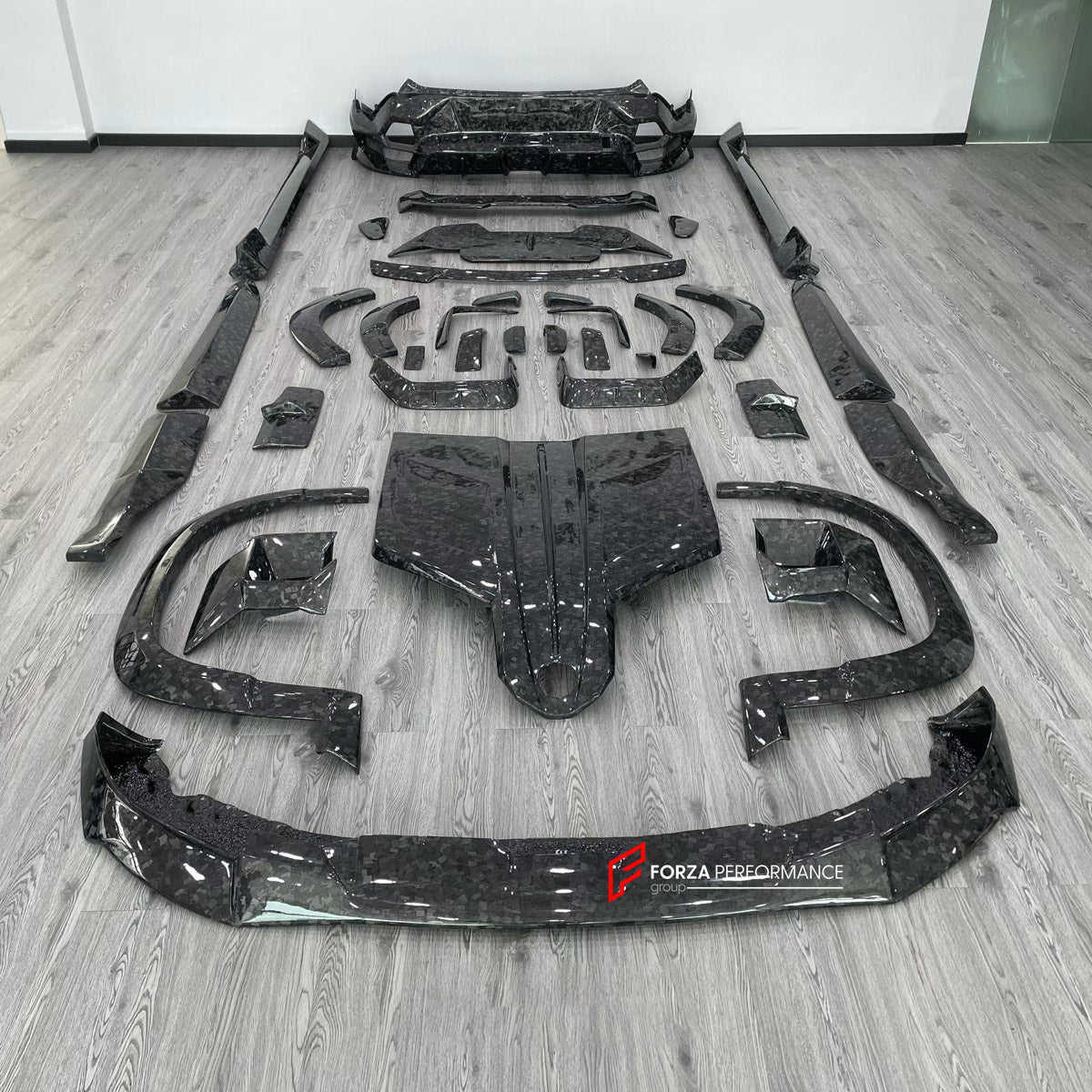 FORGED CARBON BODY KIT for BMW XM G09 2023+ FORZA PERFORMANCE custom fit Mansory Style

Set includes:
Front Lip
Headlight Covers
Hood Bonnet
Fender Flares
Body Side Door Moldings
Side Skirts
Roof Spoiler
Ducktail Spoiler
Rear Bumper Assembly
Rear Diffuser

Material: Forged Carbon

NOTE: Professional installation is required.