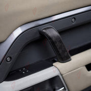 FORGED CARBON FIBER INTERIOR TRIM KIT for LAND ROVER DEFENDER 110 L663 2020+
Set includes:

Dashboard Air Vent Trims
Dashboard End Cap Trims
Dashboard Cover Trim
Gear Shift Panel Trim
Center Console Panel Trim
Door Grab Handle Trims
Small Trim Strips
Material: Forged Carbon Fiber

NOTE: Professional installation is required.