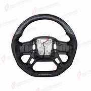 FORGED CARBON FIBER STEERING WHEEL for LAND ROVER DEFENDER 110 L663 2020+
Set includes:

Steering Wheel
Material: Forged Carbon Fiber

NOTE: Professional installation is required.