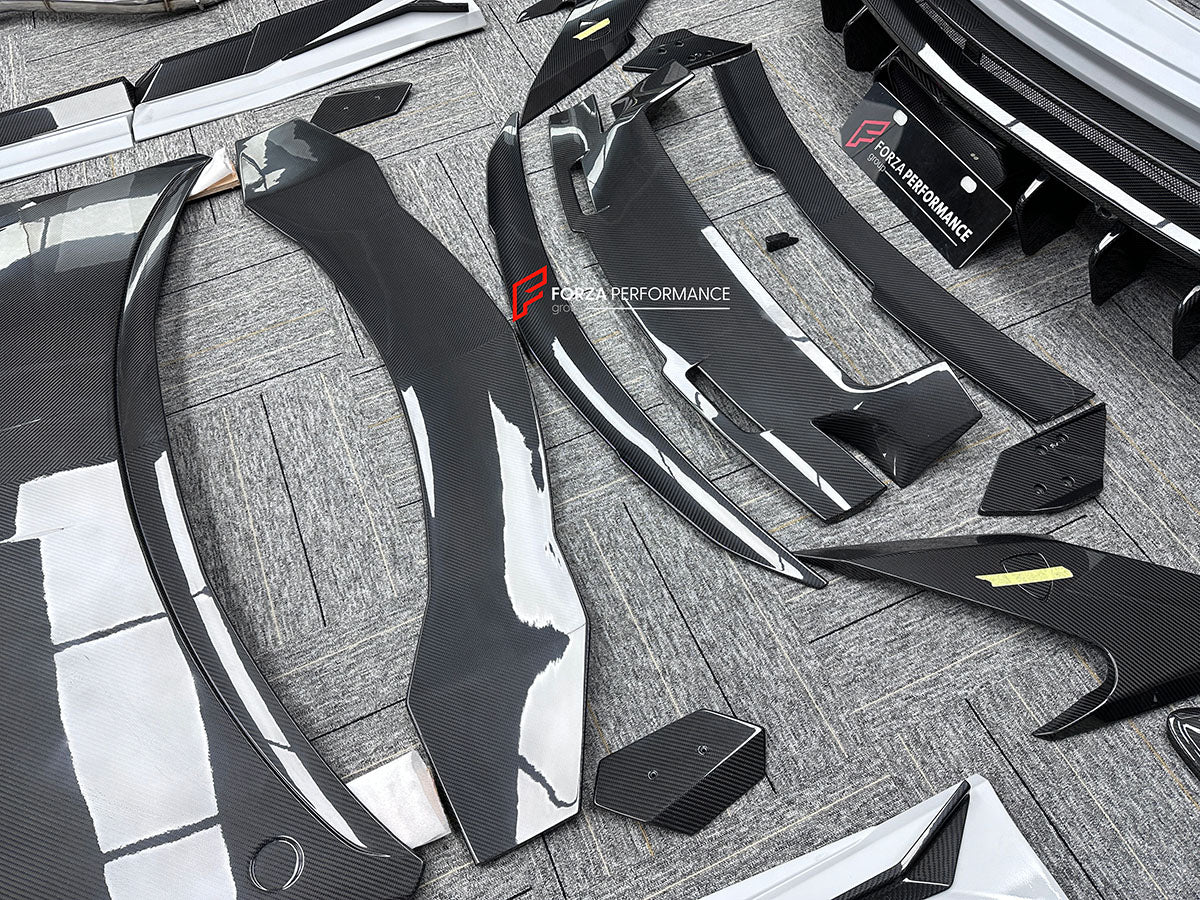 CARBON BODY KIT for LAMBORGHINI URUS S PERFORMANTE

Set includes:

Front Bumper 
Hood
Side Fenders
Side Skirts
Roof Spoiler
Rear Spoiler
Rear Bumper
Exhaust Tips
Exhaust System

Material: Carbon Fiber

Note: Professional installation is required.
