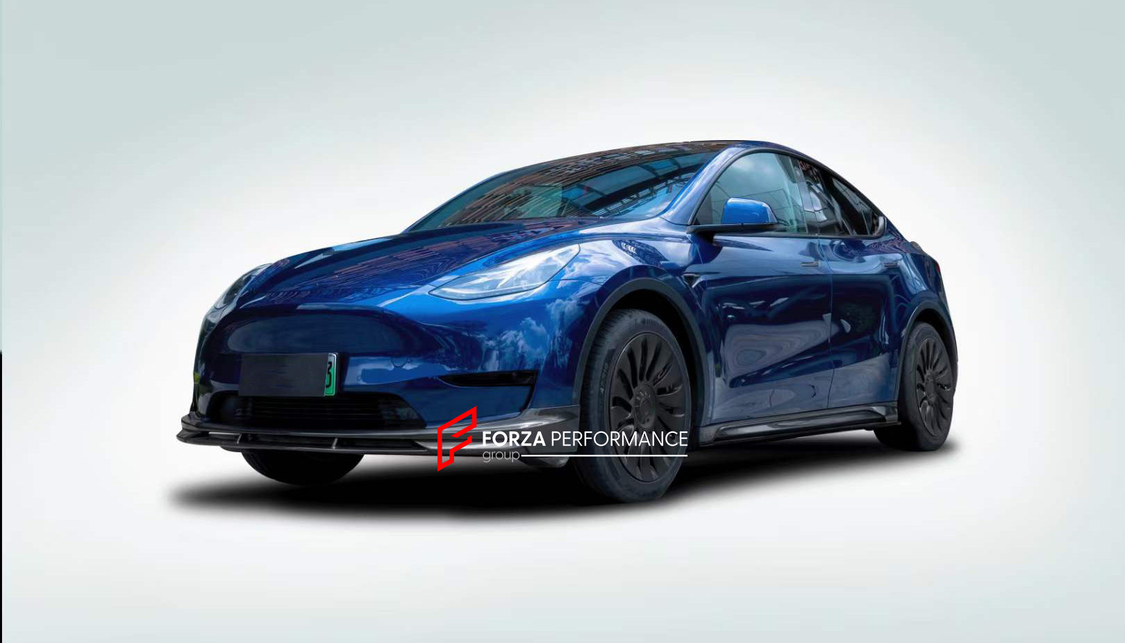 Forza Carbon Body Kit Design for Tesla Model Y  Set includes:  Front lip Side skirts  Rear diffuser Rear spoiler