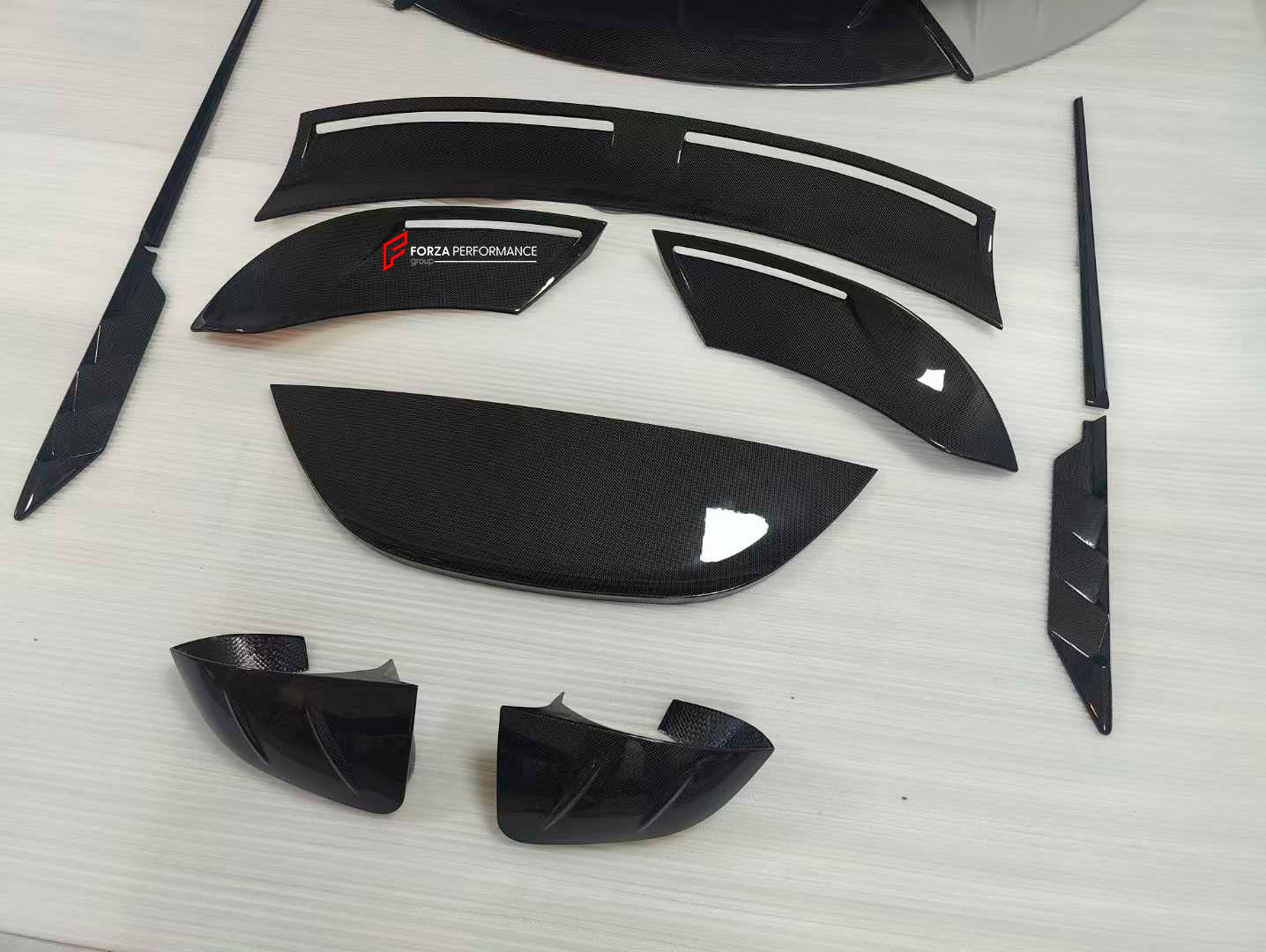 CARBON BODY KIT for FERRARI ROMA

Set includes:

Front Bumper
Front Grille
Hood / Bonnet
Side Mirror Covers
Side Trims
Side Skirts
Trunk Panel
Rear Spoiler

Rear Diffuser

Material: Carbon Fiber

Note: Professional installation is required.