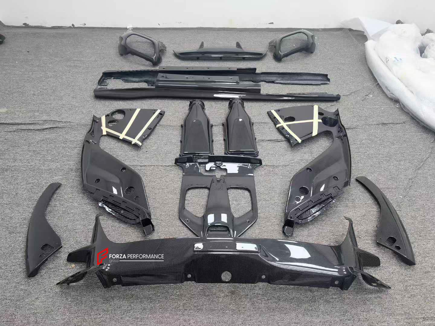 REPLACEMENT CARBON BODY KIT for FERRARI 812 SUPERFAST GTS 2017+

Set includes:

Front Splitter
Engine Bay Panels
Door Seals
Side Skirts
Rear Hood / Bonnet Lower Insert
Rear Lip
Rear Diffuser

Material: Dry Carbon

Note: Professional installation is required
