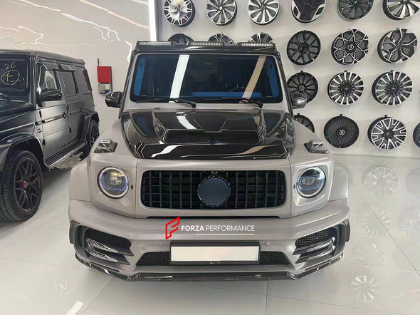 طقم هيكل عريض لـ Mercedes-Benz G-CLASS W463A W464 G63 2018+  مجموعة تشمل:  هود / بونيه المصد الأمامي مصابيح أمامية LED DRL كاناردز الأمامية شريط LED بالسقف الأمامي حاجز مشاعل المصدات الجانبية فتحات هواء جانبية أغطية الأبواب الديكورات الجانبية التنانير الجانبية الصدام الخلفي